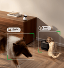 Scout smart camera - PETLIBRO on a wooden surface with two pets, Charlie and Milo, being monitored.
