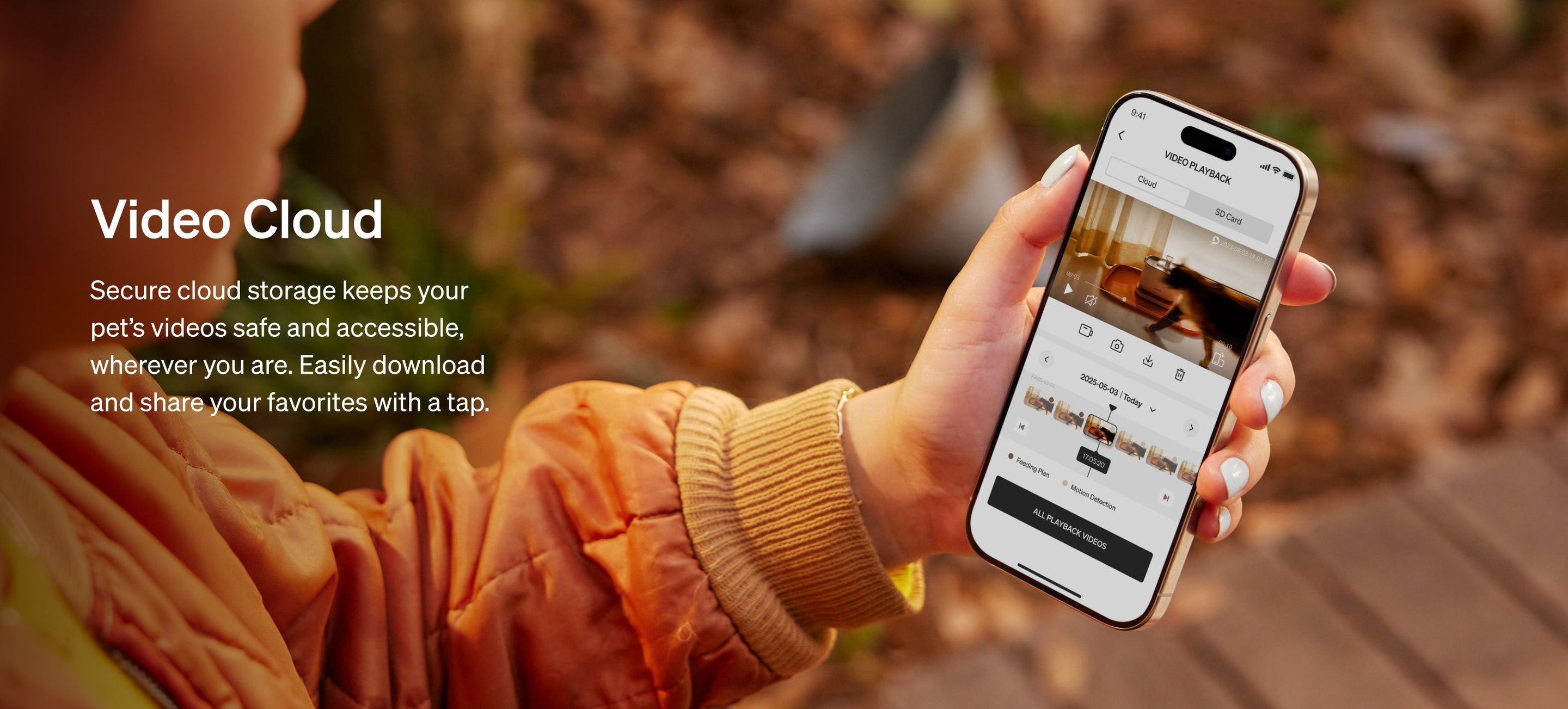 Petlibro lifestyle image showing a person holding a smartphone with pet video cloud storage app interface outdoors in autumn setting