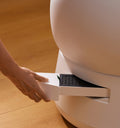 Petlibro automatic cat litter box with a white pull-out drawer for waste disposal on a wooden floor