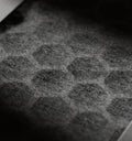 Petlibro close-up of a black textured pet grooming mat covered with light-colored pet hair fibers