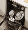 Petlibro stainless steel pet feeding bowls in dishwasher on kitchen floor with white countertop and cabinets